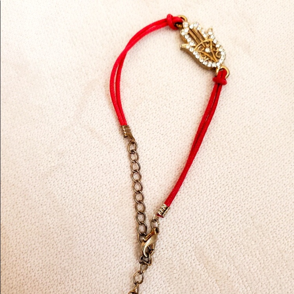 Gold Encrusted Hamsa Hand bracelet on Red